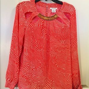 Long sleeve with a red cut out and attach bling